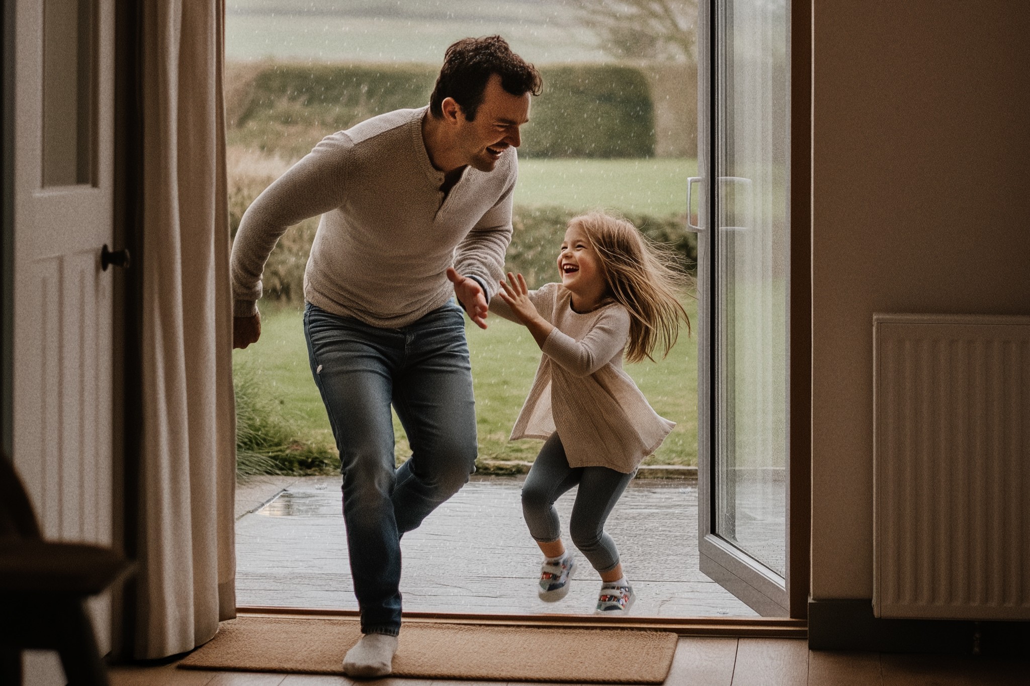 Father and Daughter running in from the rain