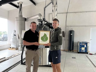 calor sales rep presents btwenty7 owner with a biolpg certification